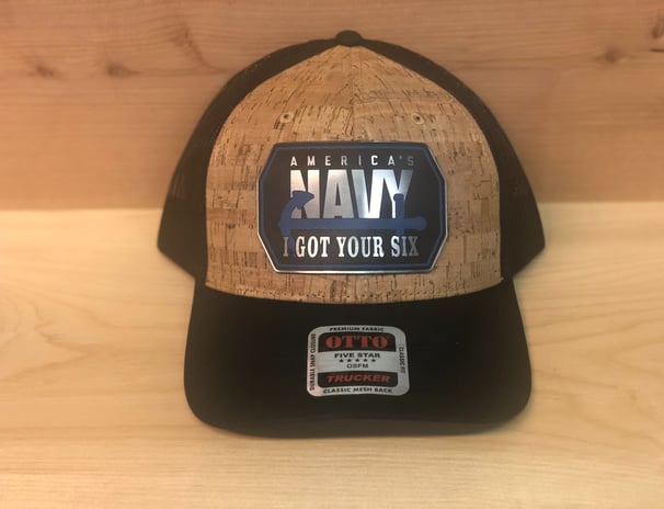 a hat with a navy blue and white logo on it
