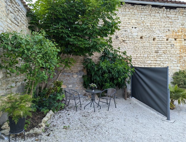 a patio with a table and chairs and a table
