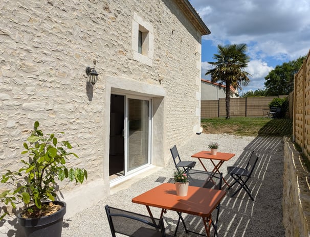 a table with chairs and tables outside