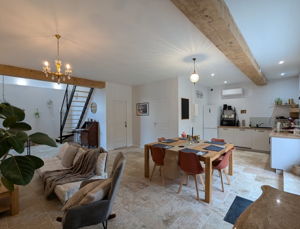 a dining room with a table and chairs