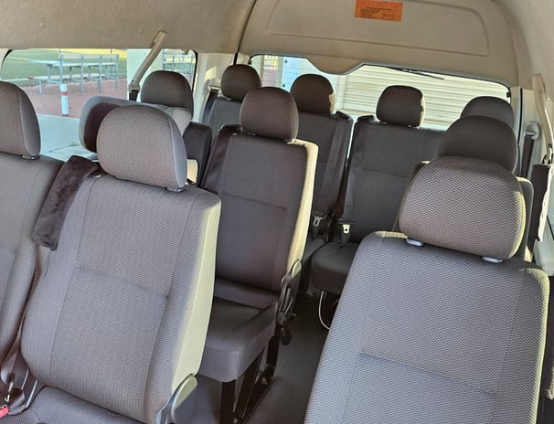 Spacious 14-seater van for group tours and airport shuttle service