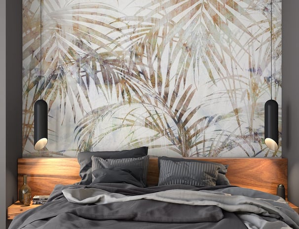 a bed with a large painting on the wall