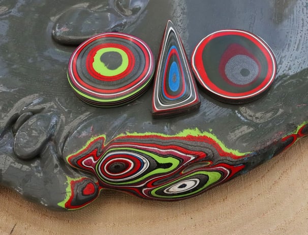 "Colorful layered Fordite cabochons handcrafted from recycled automotive paint, ideal for unique jew