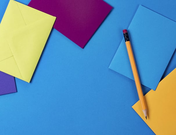 a pencil and pencil on a blue background