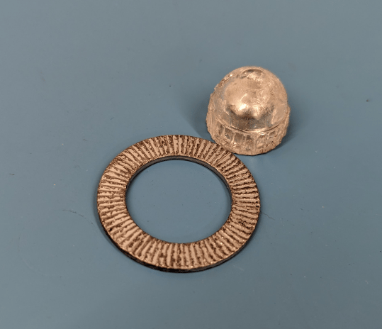 a metal object with a ring on it