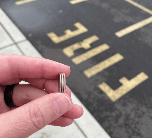 a person holding a ring with a ring on it