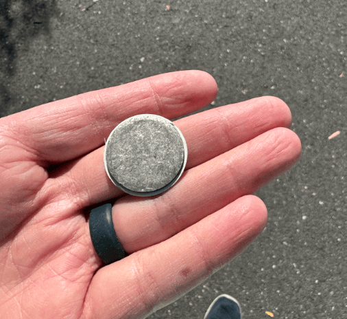 a person holding a coin with a coin