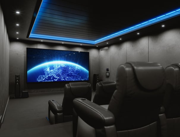 Custom basement home theatre with recliner seating, surround sound, and LED lighting in London, ON.