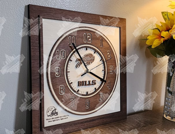 a wooden multi-layered  maple and mahogany football themed clock on a table with a vase of flowers