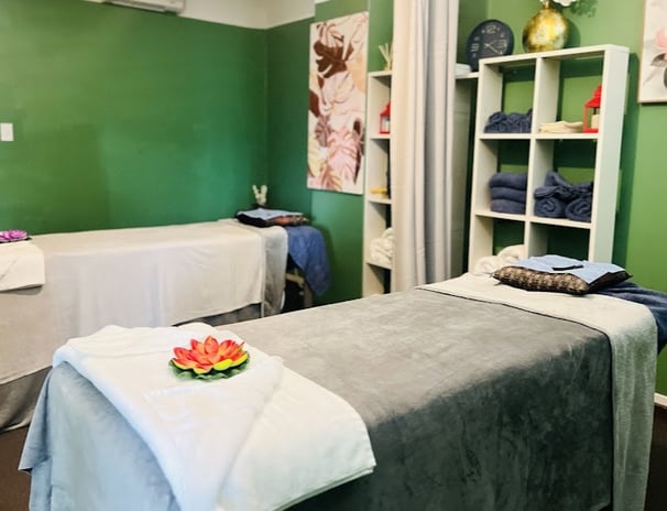 Certified Thai massage therapist performing traditional massage on a client in Ashburton spa