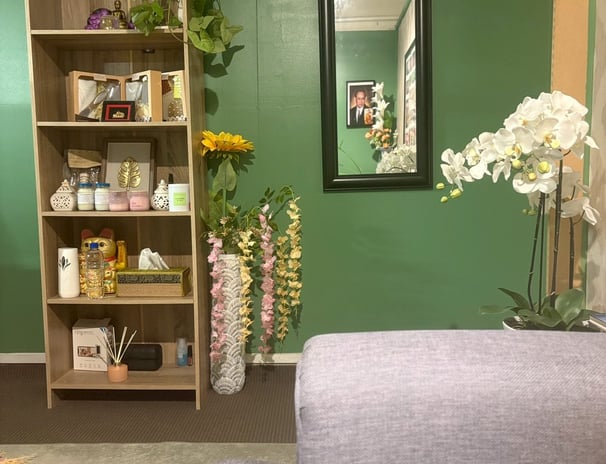 Reception area of Ashburton Thai Massage & Spa featuring a welcoming desk, comfortable seating, and