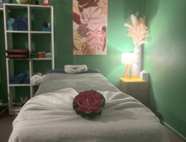 Serene treatment room at Ashburton Thai Massage & Spa featuring a comfortable massage bed, soft ligh