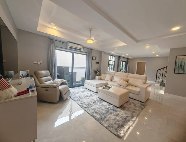 a living room with a couch and a television