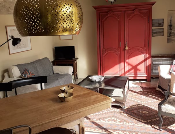 a living room with a table and chairs