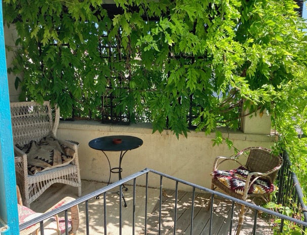 a patio with a table and chairs and a table