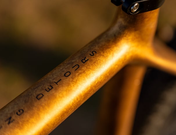 a custom painted OPEN CYCLE Wide with black and gold