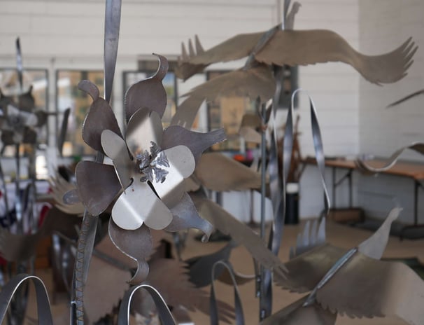 metal flower sculptures in a room
