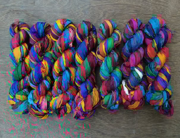 multicolour recycled sari silk ribbon yarn. 1" wide, 50+ meters in 100 gram skein