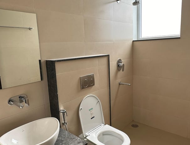An luxury bathroom with a hot water shower and a designer look