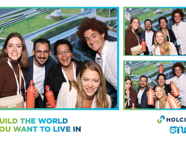 a group of people posing for a photo booth