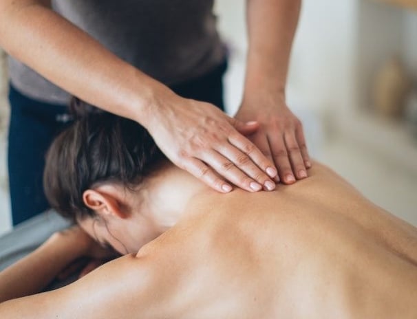 a woman getting a massage at a massager