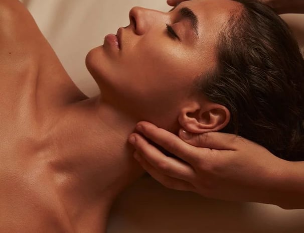 a woman getting a massage at a spa