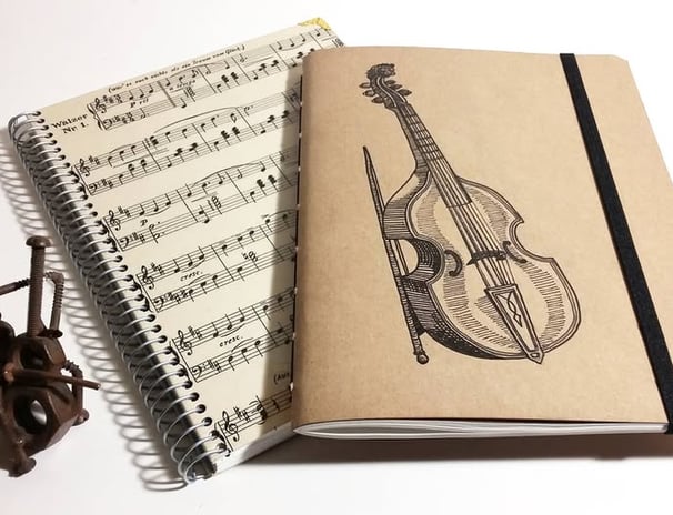 a notebook with a violin and a violin