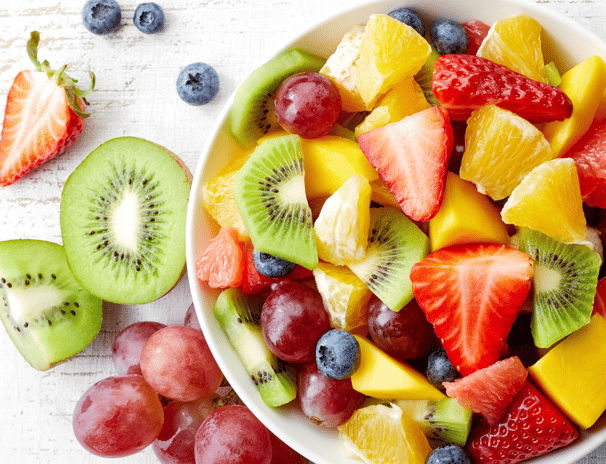 a bowl of fruit and fruit juice
