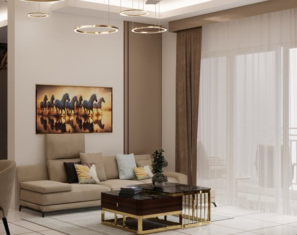 Lounge area with a premium sofa set, coffee table & lit with a modern chandelier