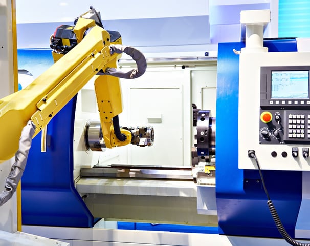 fanuc robot loading a part into a lathe cnc machine