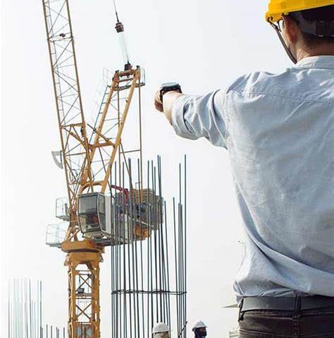 a construction worker is holding a cell phone