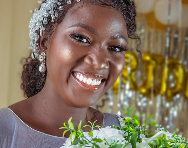 a woman in a white dress holding a bouquet