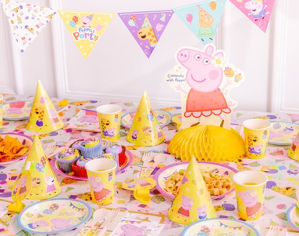 a table with a pep pep the pig party hat