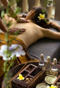 a woman getting a massage at a spa
