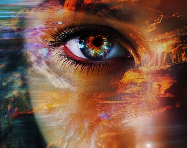 a woman's eye is reflected in a photo