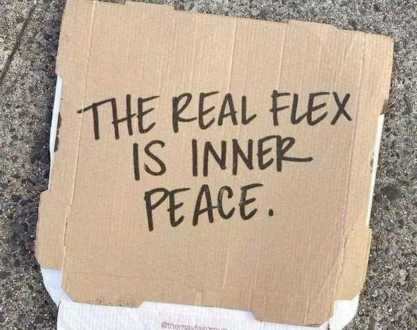 a cardboard box with a sign that says the real fix is inner peace peace peace