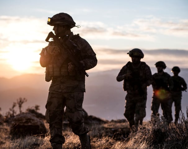 a soldier using a tactical watch strap on his tacital watch