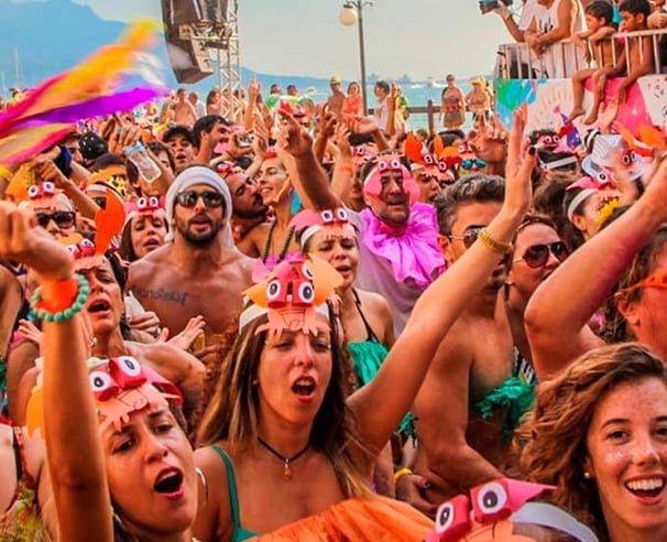 a group of people standing in front of a crowd of people