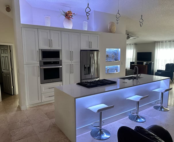 Custom kitchen renovation with granite countertops, upgraded flooring, and recessed lighting by FC I
