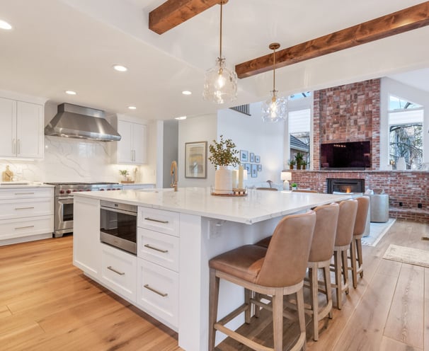 a kitchen with a large island and a fireplace