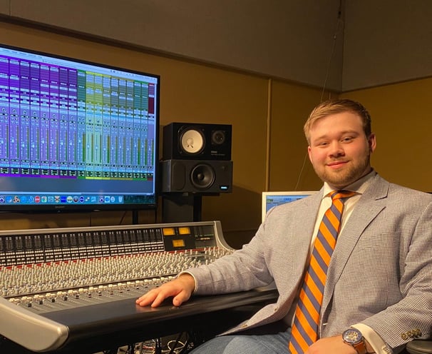 Andrew Wimple posing in front of a SSL 948 delta console.
