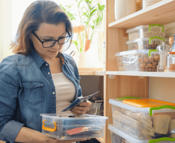 Women looking at seed packets.