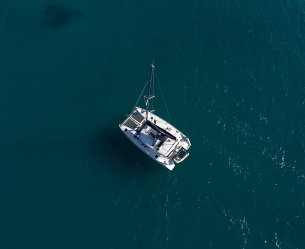 Drone shot of a catamaran on the water - Catamaran Fishing Charters Seychelles