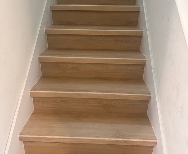 Professional flooring installation in Central Florida home with premium vinyl planks, moisture barri