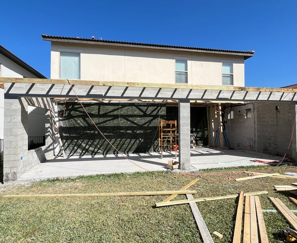 Porch renovation project including new columns, concrete flooring, and weather-resistant finishes fo