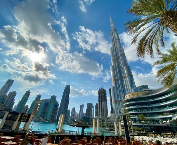 a view of a city skyline with a tall building in the background