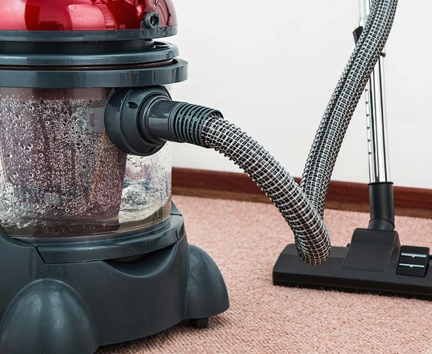 a vacuum cleaner is sitting on the carpet