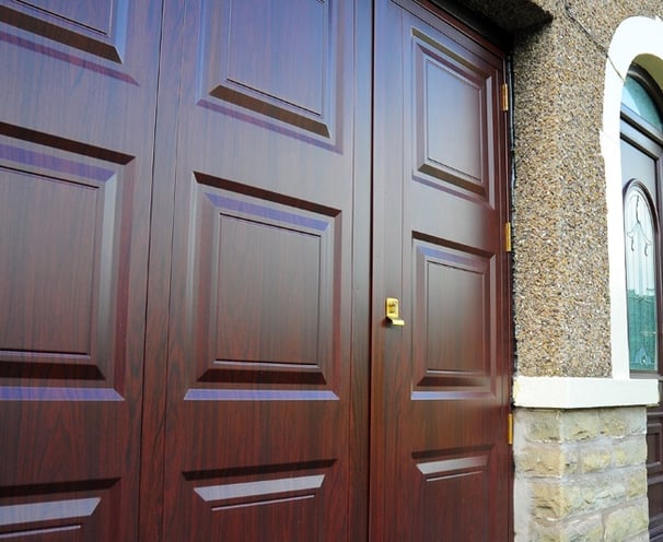 uPVC garage doors with secure locking pass door