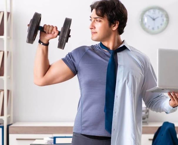 a corporate employee exercising in office