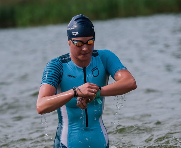 enduranceID with Dasha in the water finishing the swim part on a triathlon event